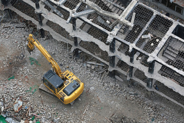 The backhoe demolition of the building.
