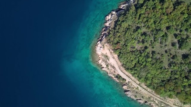 Aerial view of crystal clear water off the coastline inisland Krk, Croatia. Top view.