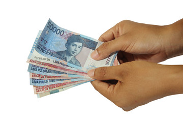 hands giving out money on white background, rupiah money