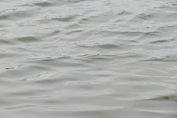 Gray water surface on the river, natural background