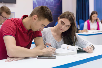 Obraz premium University Students during the class. Resolving problems together. Team work concept.