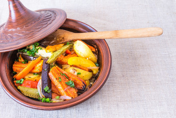 Traditional Moroccan and Algerian cuisine - vegetarian dish, tajine or tagine with potatoes,...
