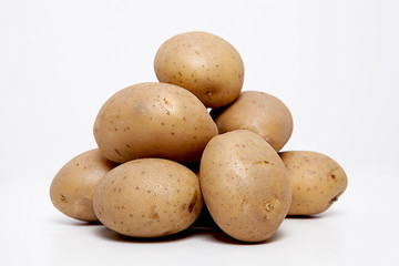  Potatoes on the white background.