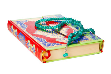 Islamic Book Holy Quran and beads on withe background