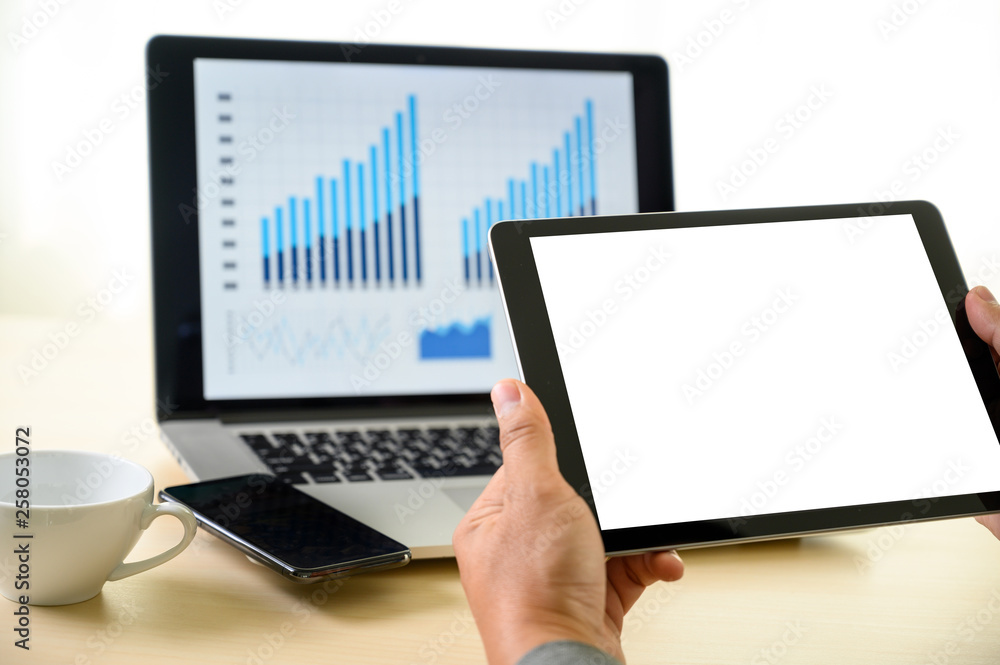 Poster man hands multitasking man using tablet close up close up working in office
