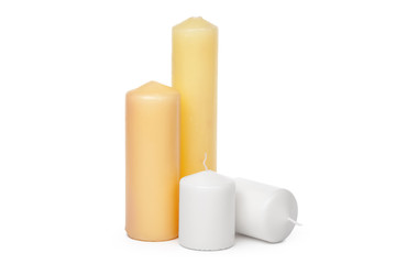 different sized candles on a white background