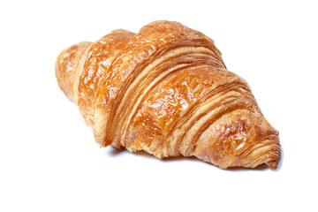Fresh croissant close up isolated on white background, side view