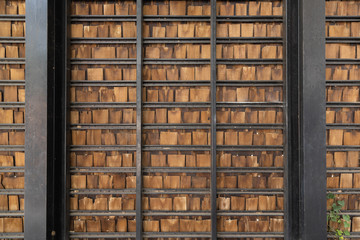 pieces of wooden plank wall with black steel shelves.