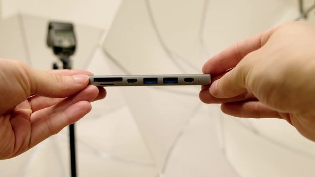 Footage of Satechi USB-C hub Space Grey adapter with Macbook Pro touchbar laptop for creative work.