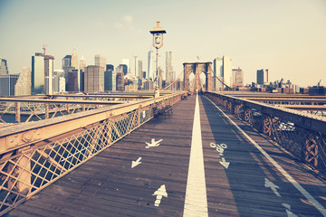 Retro toned picture of the Brooklyn Bridge and Manhattan skyline, New York, USA.