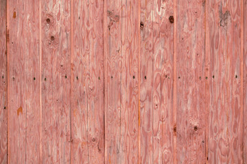 Obraz premium Vertical pink wooden planks forming a rustic wood texture background