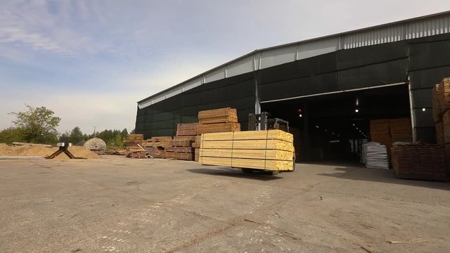 Forklift drives to the truck's open body