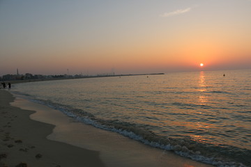 Scenic sunset and natural dramatic cloudy sky and sunbeam view over Dubai, United Arab Emirates