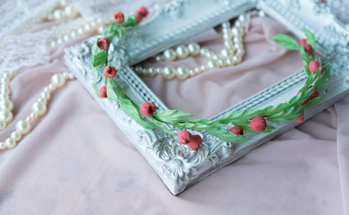 Wedding background with pearls and hair accessories on pink background
