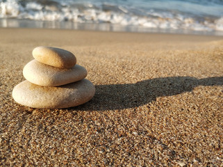 Fototapeta na wymiar Balanced stones on a beach