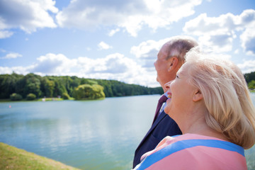 Fototapeta premium Elderly couple on a walk in a country park