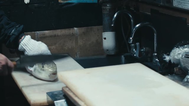 Japanese chef tries to stun alive blowfish with a knife