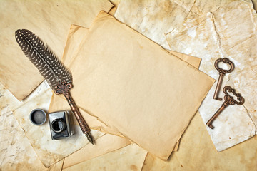 Mock up of empty vintage paper sheets with quill pen and ink