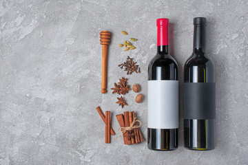 Winter spices for mulled wine with mockup bottles of wine