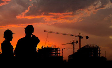 Fototapeta na wymiar Silhouette engineer standing work on construction.