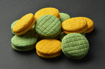 Colorful macaroons on black background