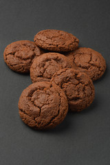 Chocolate cookies on black background