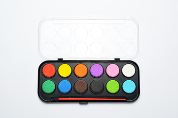 Watercolor paints box on white background