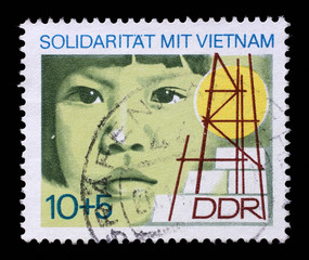 Stamp printed in GDR dedicated to solidarity with Vietnam, circa 1973.