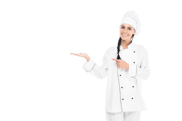 Cheerful smiling chef in hat gesturing isolated on white