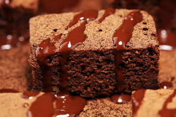 Brownie dessert. Cake chocolate brownies on wooden background with mint.