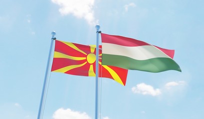 Hungary and Macedonia, two flags waving against blue sky. 3d image