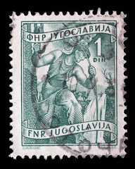 Stamp issued in Yugoslavia shows High voltage technician, Local Economy series, circa 1950.