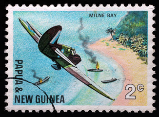 Stamp from Papua New Guinea shows Air attack at Milne Bay, series 25th anniversary of the Pacific War, issued in 1967.