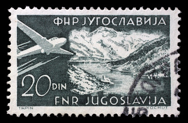 Stamp issued in Yugoslavia shows Bay of Kotor, Airplanes and Landscapes series, circa 1951.
