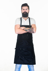 This is what man wants to look like. Long bearded man keeping arms crossed. Bearded man wearing barber or cooking apron. Hipster with bearded face. Bearded barber or cook