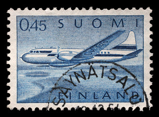 Stamp printed in Finland shows Aircraft Convair 440 over Lake Landscape, circa 1963