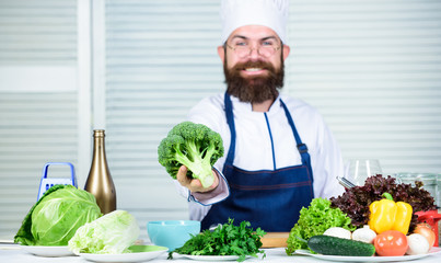 Vegetarian. Mature chef with beard. Dieting and organic food, vitamin. Bearded man cook in kitchen, culinary. Chef man in hat. Secret taste recipe. Healthy food cooking. Beautiful food