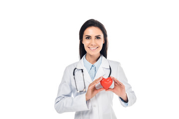 Doctor in white coat holding plastic heart isolated on white