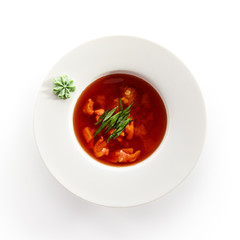 Red Soup with Seafood in White Plate Isolated