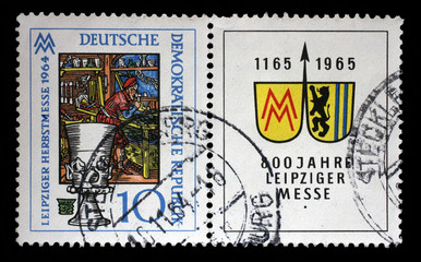 Stamp printed in Germany - Democratic Republic (DDR), shows Medieval Glass Workshop, Leipzig Spring Fair, circa 1964.