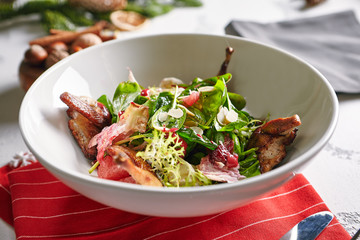 Warm Salad with Quail, Plums and Spinach Close Up