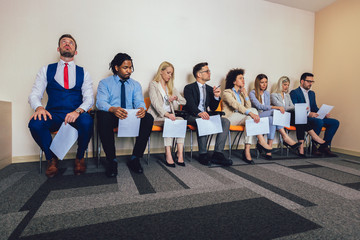 Photo of candidates waiting for a job interview. Selective focus