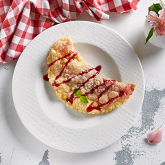 Sweet Berry Cheburek with Confiture, Powdered Sugar and Mint Top View