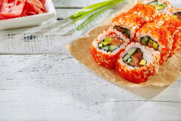 California Sushi Roll with Cucumber Avocado and Salmon Inside