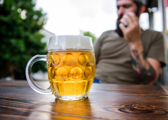 Sitting around drinking beer. Hipster drinking beer in bar. Bearded man drinking alcohol in pub. Brutal man having drinking habits. Relaxing with alcoholic drink in beer restaurant