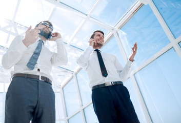 bottom view.business partners are talking on a mobile phone