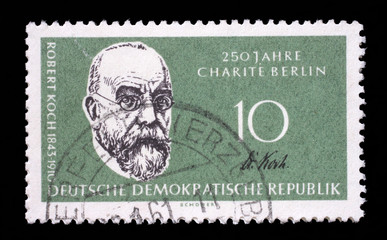 Stamp issued in Germany - Democratic Republic (DDR) shows Prof. Dr. Robert Koch, bacteriologist, 125th annivers. of the Humboldt university, 250th annivers. of the Charité, circa 1960.