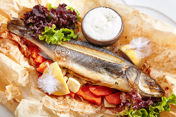 Fish Baked with Tomato Salsa, Greens and Olives Isolated