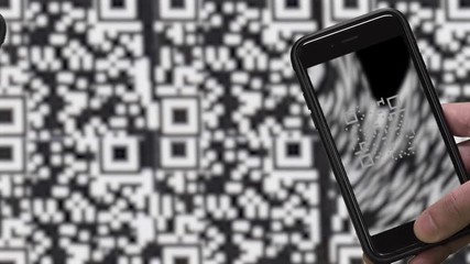 QR CODE look alike black and white pattern (CAN NOT SCAN THIS) and SMARTPHONE.  Image of scanning QR CODE.  Blurred moving black and white pattern background.