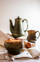 sauerkraut in a glossy cup on the table, on a light background